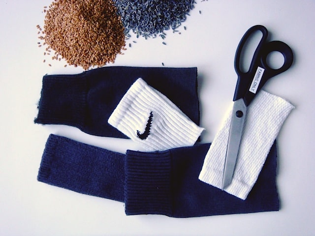 Flax seeds Lavender and cut up socks next to scissors