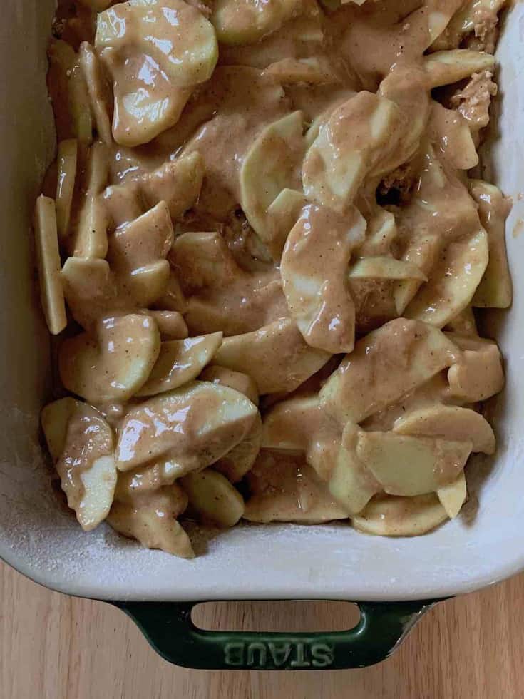 apple slices and batter in pan