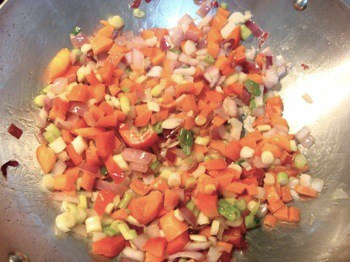 sautéing vegetables in stainless steel wok