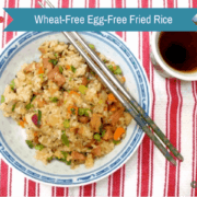 Ham and various vegetable egg free fried rice wheat free soy sauce in blue white bowl