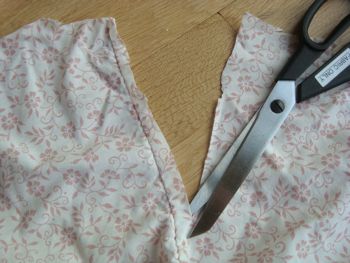 cutting old sheets with scissors