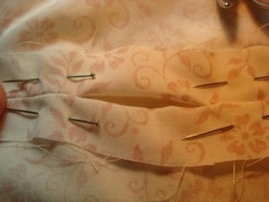 pins in old sheet to hold in place before sewing