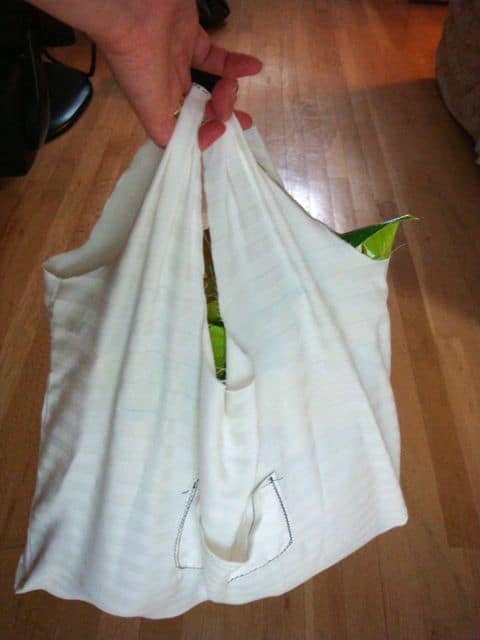 white reusable grocery bag with groceries inside