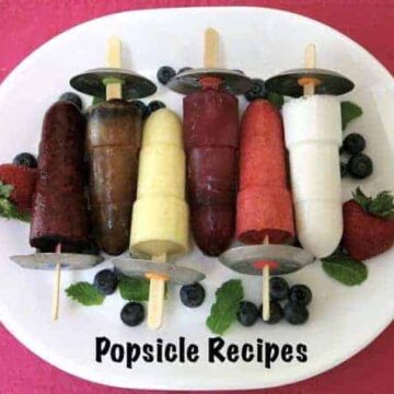 popsicles on white plate on pink placemat