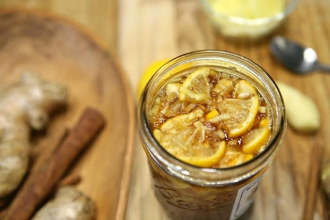 Stirred Honey Ginger Immune Booster Syrup in mason jar 