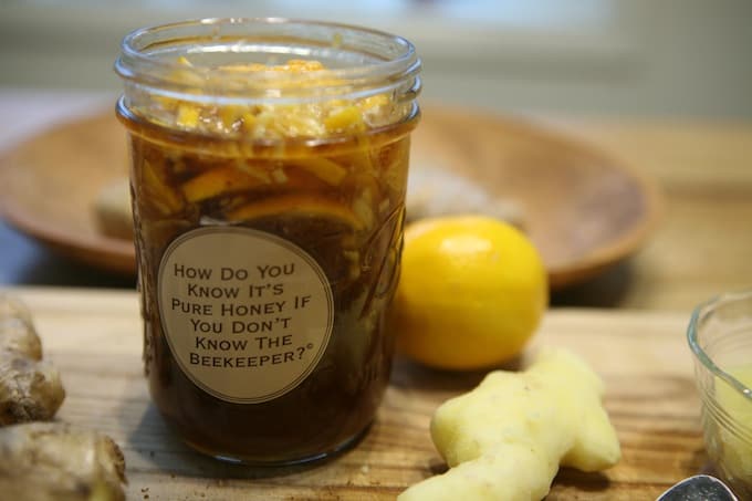 Honey lemon ginger immune booster syrup mason jar with sticker 'how do you know it's pure honey if you don't know the beekeeper?'