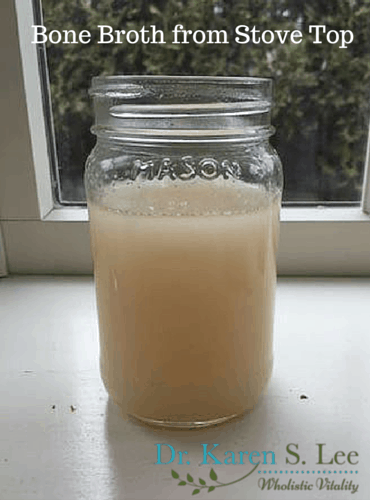 Stove Top Bone Broth in mason jar. Color is more milkier color than crockpot