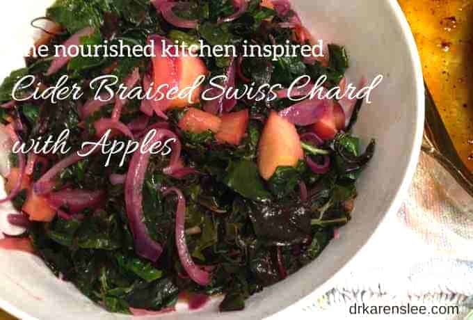 cider braised swiss chard with apples in white bowl