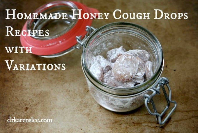 homemade honey cough drops covered in powdered sugar in glass container