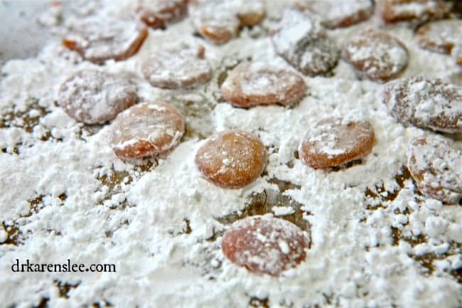 honey cough drops laying in powder sugar