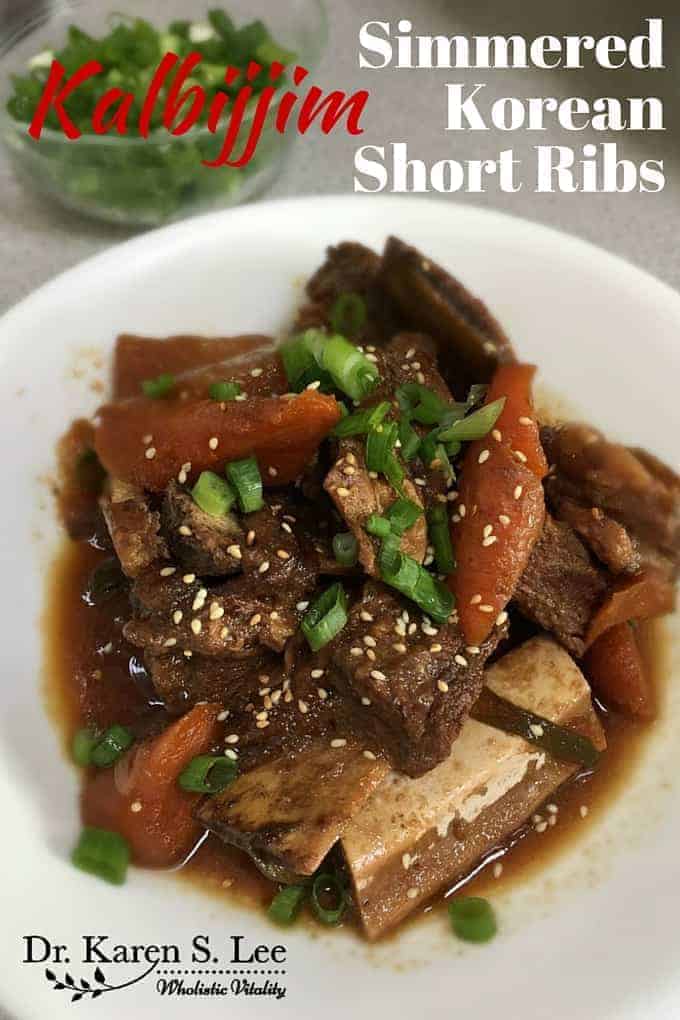 Braised shot ribs in soy sauce with carrots in a white bowl