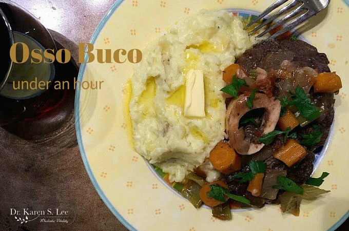 Osso Buco and mashed potatoes on yellow plate