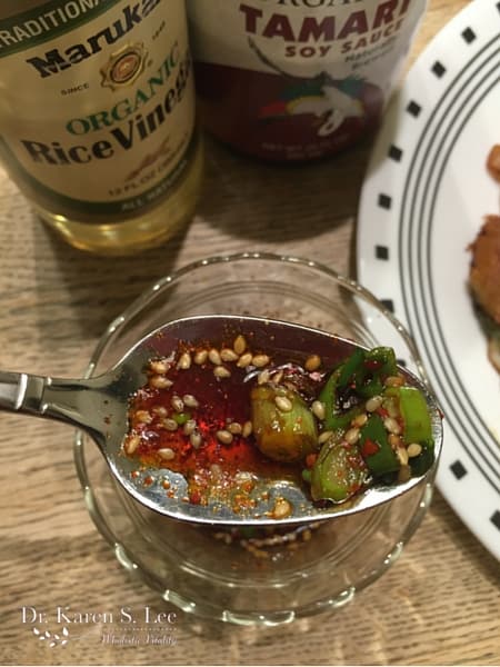 Rice vinegar and Tamari bottles behind Dipping Sauce 