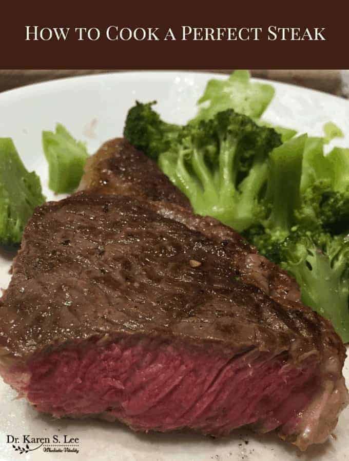 Medium rare steak and broccoli on white plate