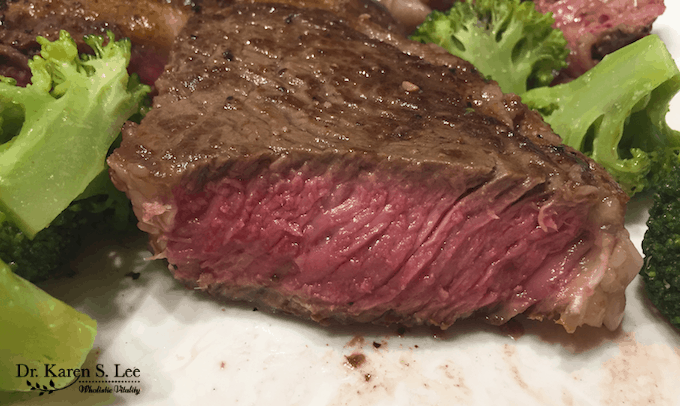 medium steak and broccoli on white plate