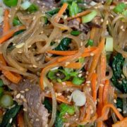 sweet potato noodles with carrots, beef, sesame seeds